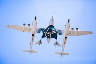 Virgin Galactic's second SpaceShipTwo, the VSS Unity, is seen during its first captive carry test flight with its mothership WhiteKnightTwo at the Mojave Air and Space Port in California on Sept. 8, 2016.