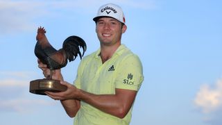 Sam Burns poses with the trophy after the 2021 Sanderson Farms Championship