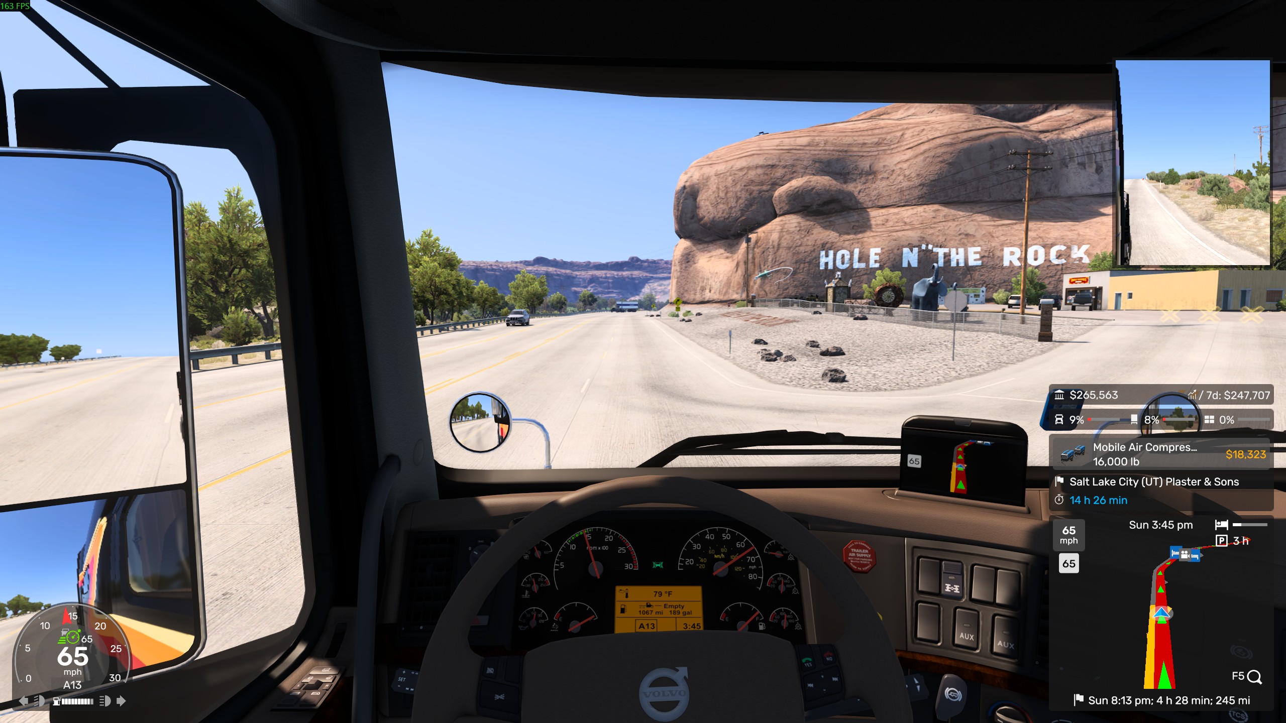 A screenshot from American Truck Simulator inside the cab of a 2014 Volvo VNL 230 driving past Hole N' The Rock in Utah.