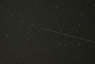 Skywatcher Brian Emfinger snapped this photo of an Orionid meteor before sunrise on Oct. 22, 2011 as the meteor streaked over Ozark, Arkansas.