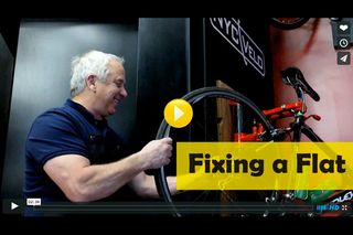 Greg LeMond fixing a flat