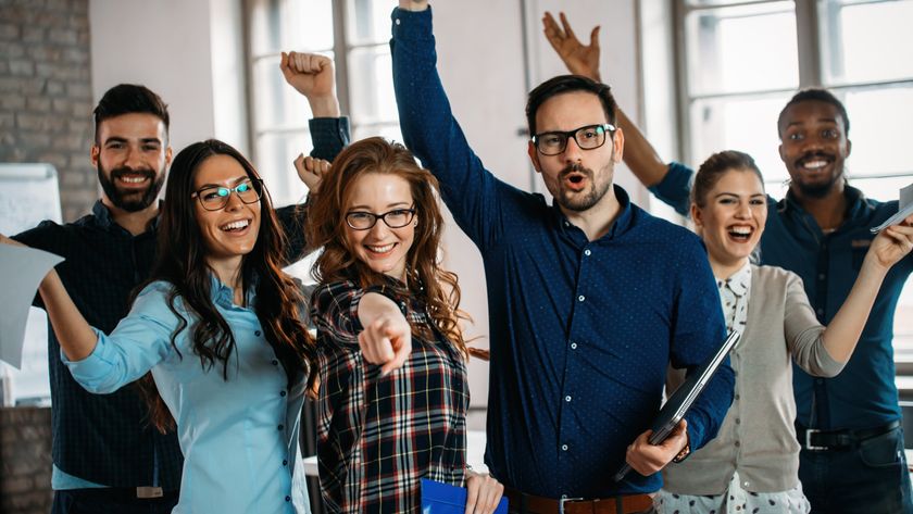 Employees cheering in an office space