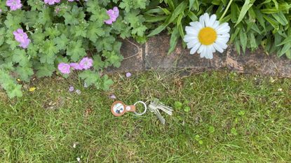 Apple AirTag keys on grass