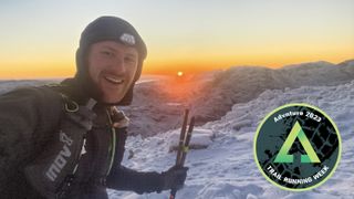 Fell runner James Gibson on mountain summit