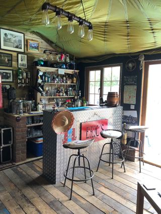 Cuprinol shed of the year: bar inside a shed with metal panelling and bar stools