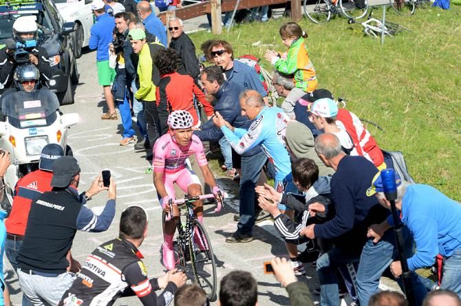 Nairo Quintana (Movistar) works his way through the crowd during the stage 19 mountain time trial