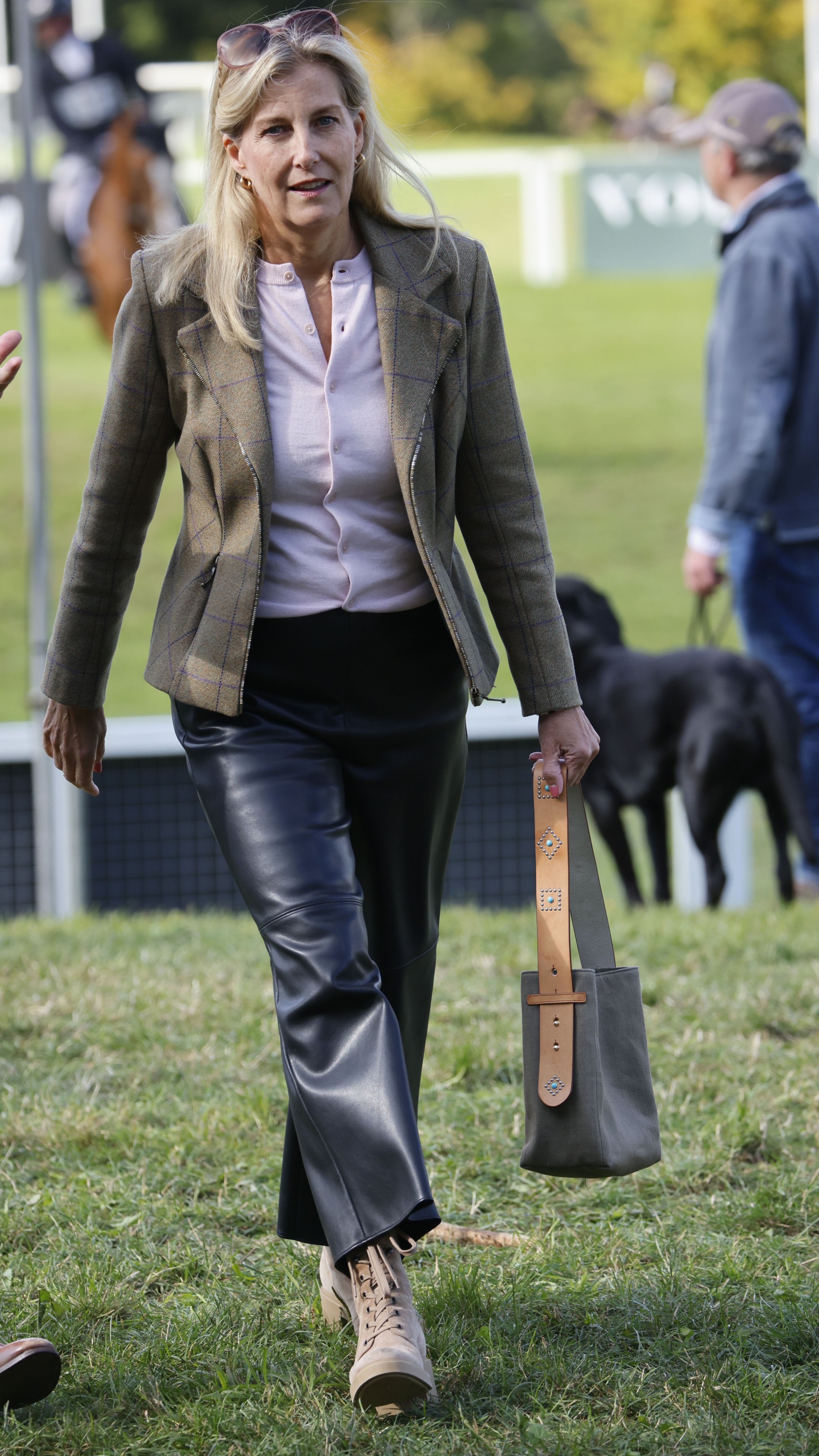 Sophie, Duchess of Edinburgh carries her bag and walks as she attends the Cornbury House Horse Trials, Oxfordshire