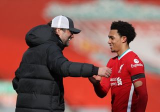 Liverpool manager Jurgen Klopp greets Trent Alexander-Arnold after the final whistle during the Premier League match at Anfield, Liverpool. Picture date: Saturday April 10, 2021