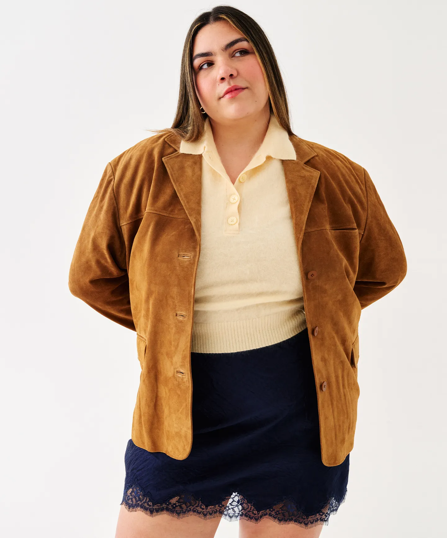 Woman in polo top and lace skirt