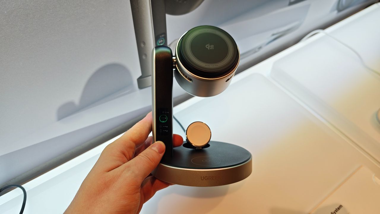 Man holding the UGreen MagFlow Pro 3-in-1 Magnetic Wireless Charging Stand 25W