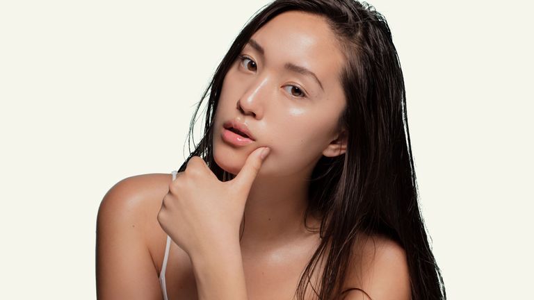 Woman posing with hand on chin