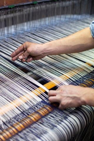 working on a vintage loom