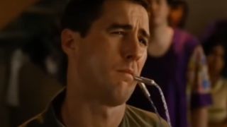Luke Wilson with a tube meant for his butt in his mouth in Idiocracy