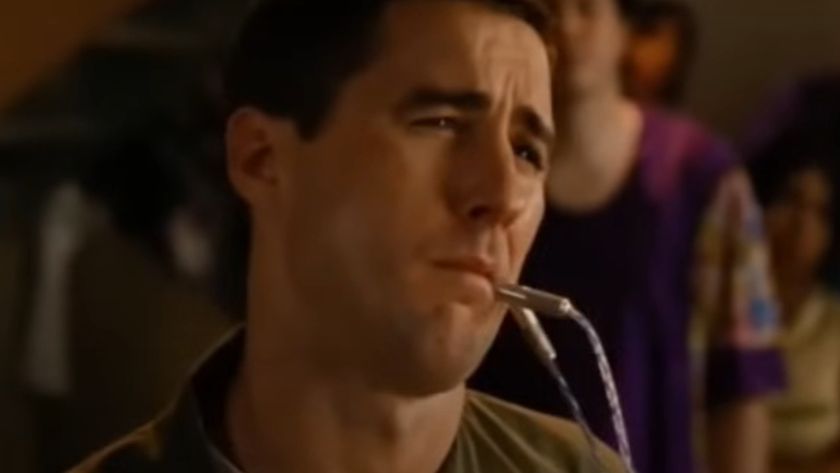 Luke Wilson with a tube meant for his butt in his mouth in Idiocracy