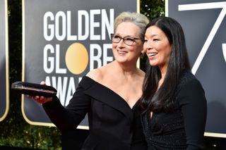 BEVERLY HILLS, CA - JANUARY 07:Actor Meryl Streep (L) and NDWA Director Ai-jen Poo attend The 75th Annual Golden Globe Awards at The Beverly Hilton Hotel on January 7, 2018 in Beverly Hills,