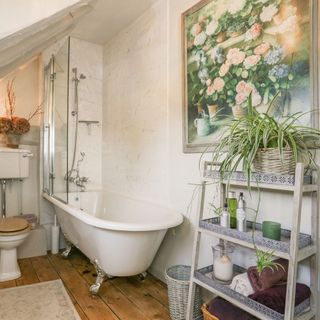 bathroom with roll top bath and french style storage unit