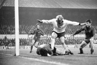 Real Madrid goalkeeper Miguel Angel saves at the feet of Derby County's Francis Lee in a European Cup clash in October 1975.