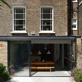 house exterior with dining area and table