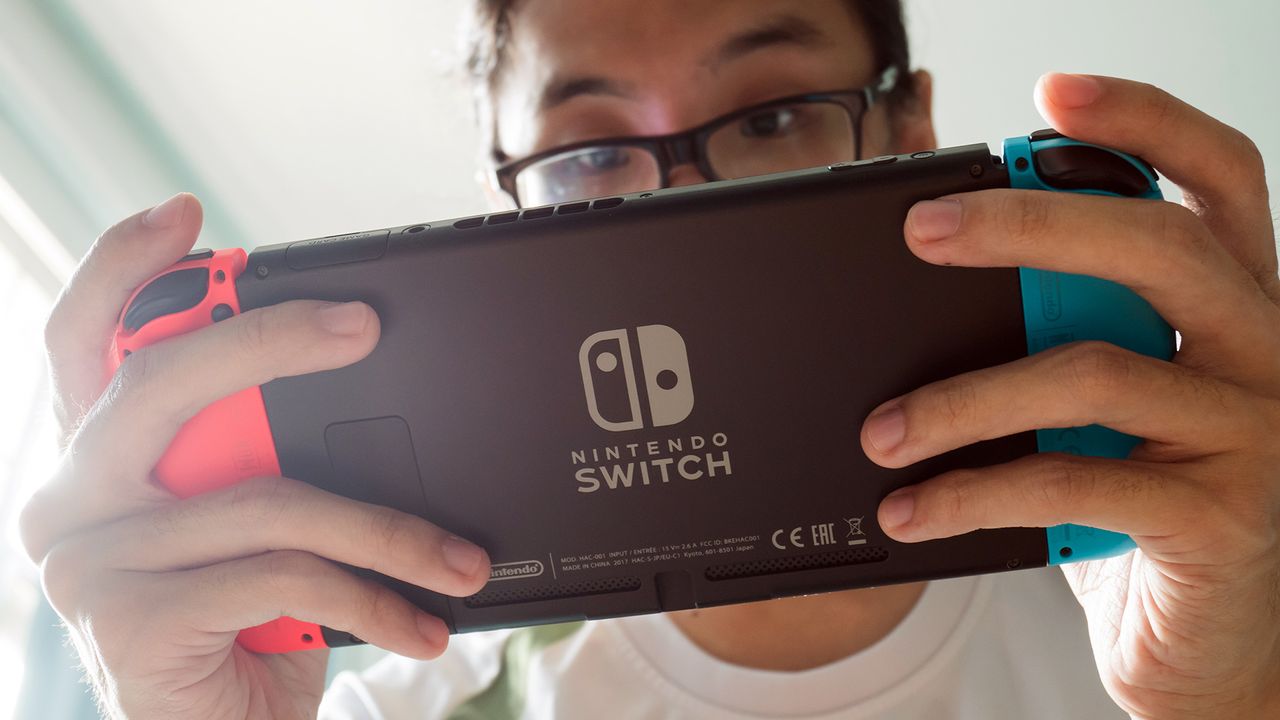 Man playing Nintendo Switch