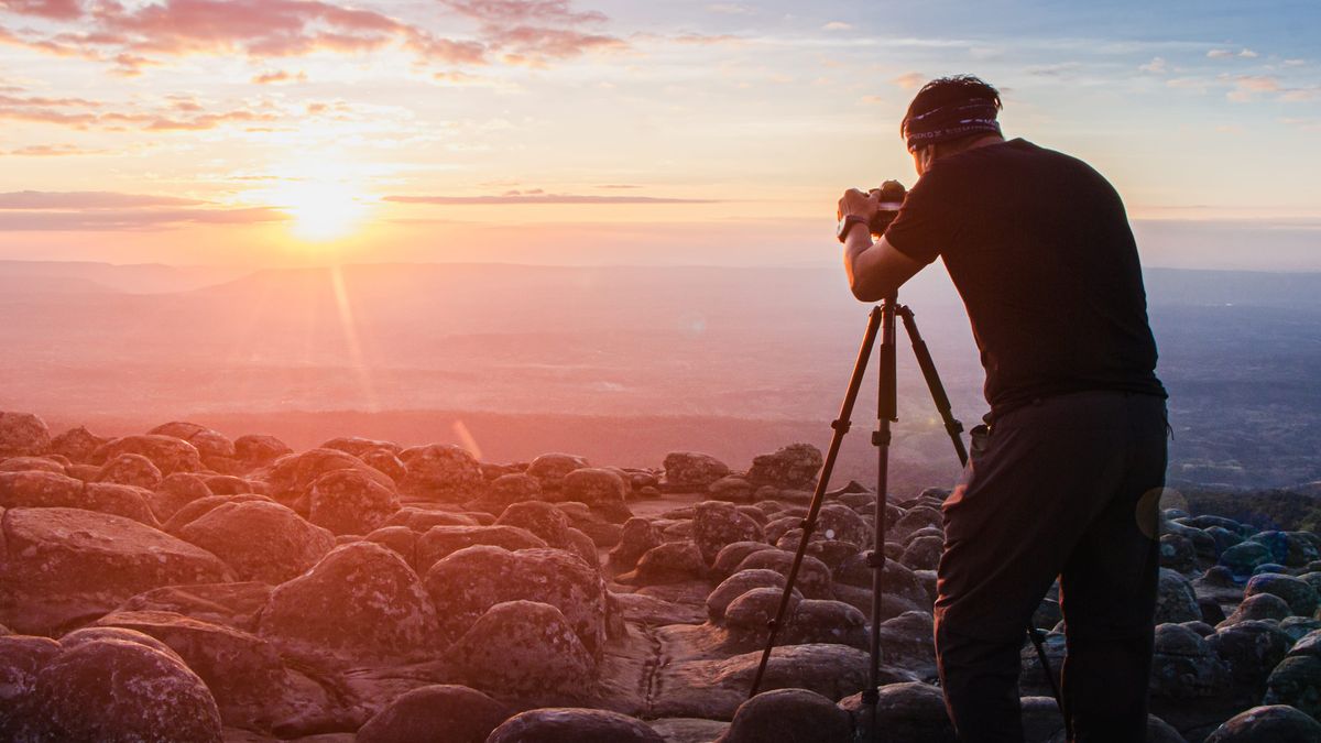 Image of a photographer using a professional camera