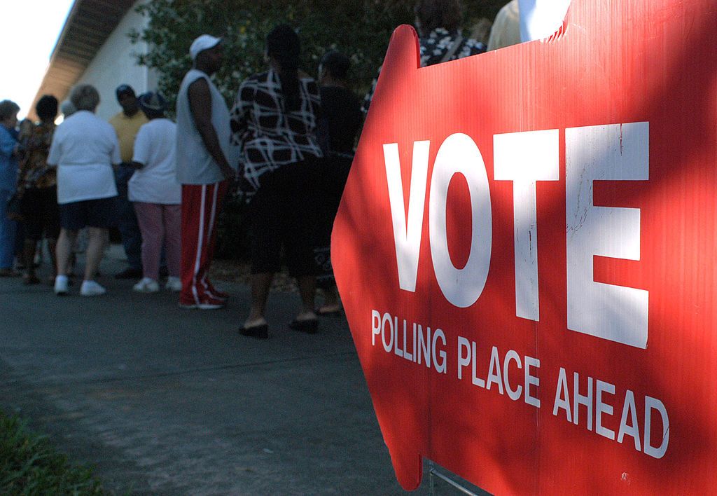 A sign points to a polling station