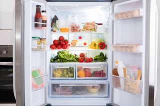 An organised fridge full of fresh food