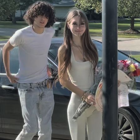 mackenzie Shirilla and Dominic russo posing together as she holds flowers next to her car in a still featured in the documentary the crash