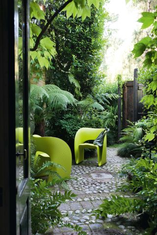 colourful garden furniture ideas: green chairs in garden from chaplins furniture