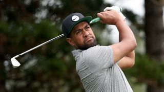 Tony Finau hits an iron shot