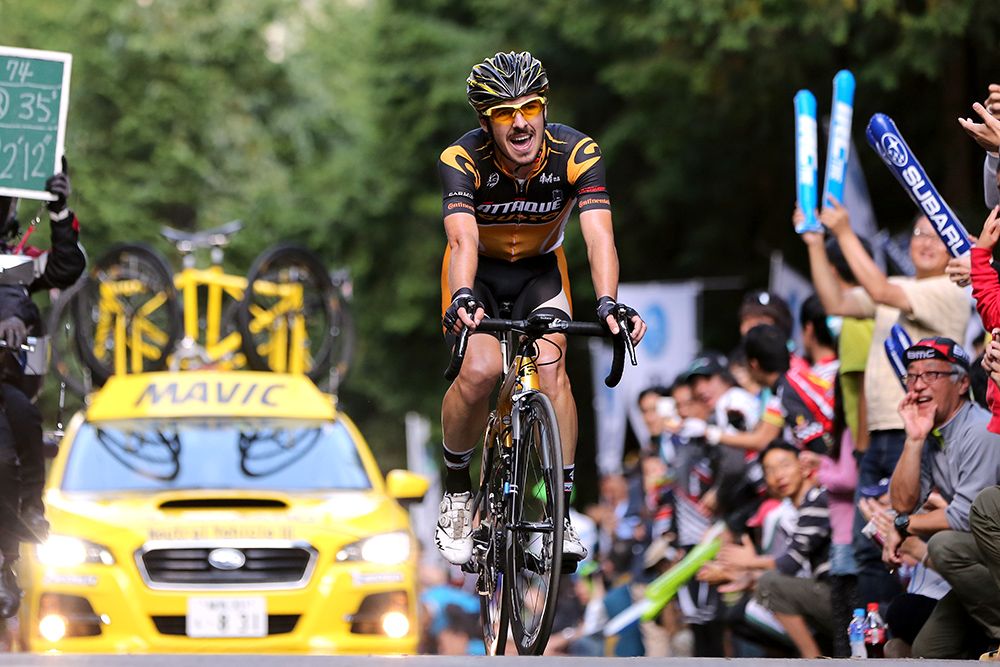 Riders crest the climb