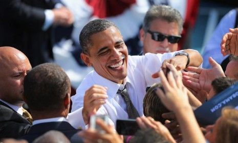 President Obama greets people after speaking at a campaign rally in Delray Beach, Florida on Oct. 23.