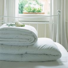 Duvets on a white bed