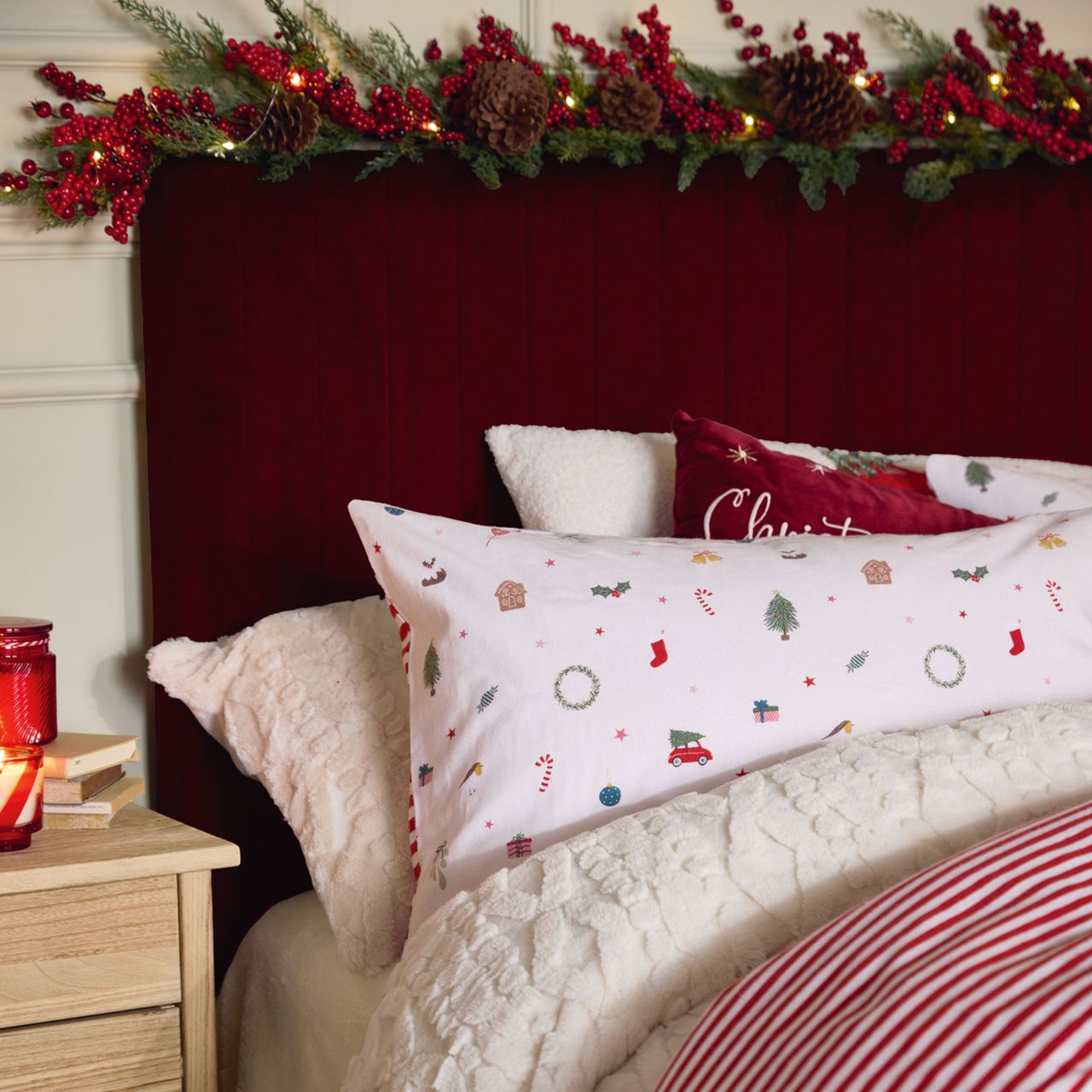 Bed with red headboard and white festive bedding