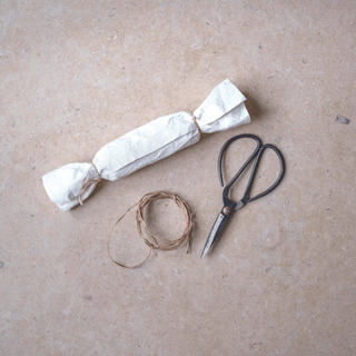Paper cracker with string