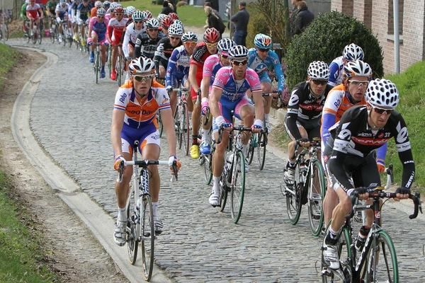 Some riders hit the cobbles while others took the easier option.