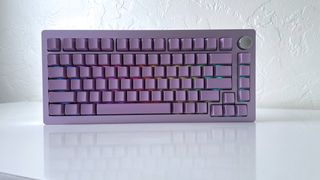 The Epomaker Tide 75 mechanical keyboard in lavender purple on a white table