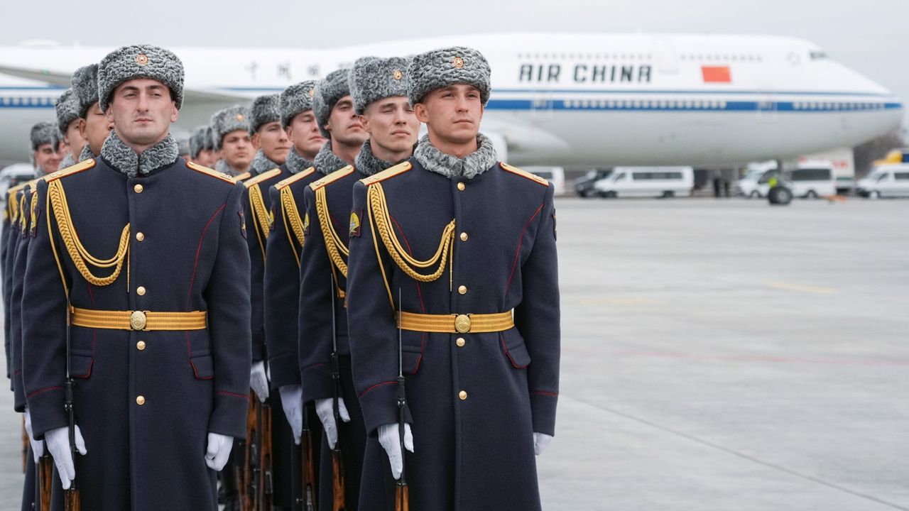 Russian soldiers line up to welcome China&#039;s president, Xi Jinping, as his plane touches down for the 16th Brics summit