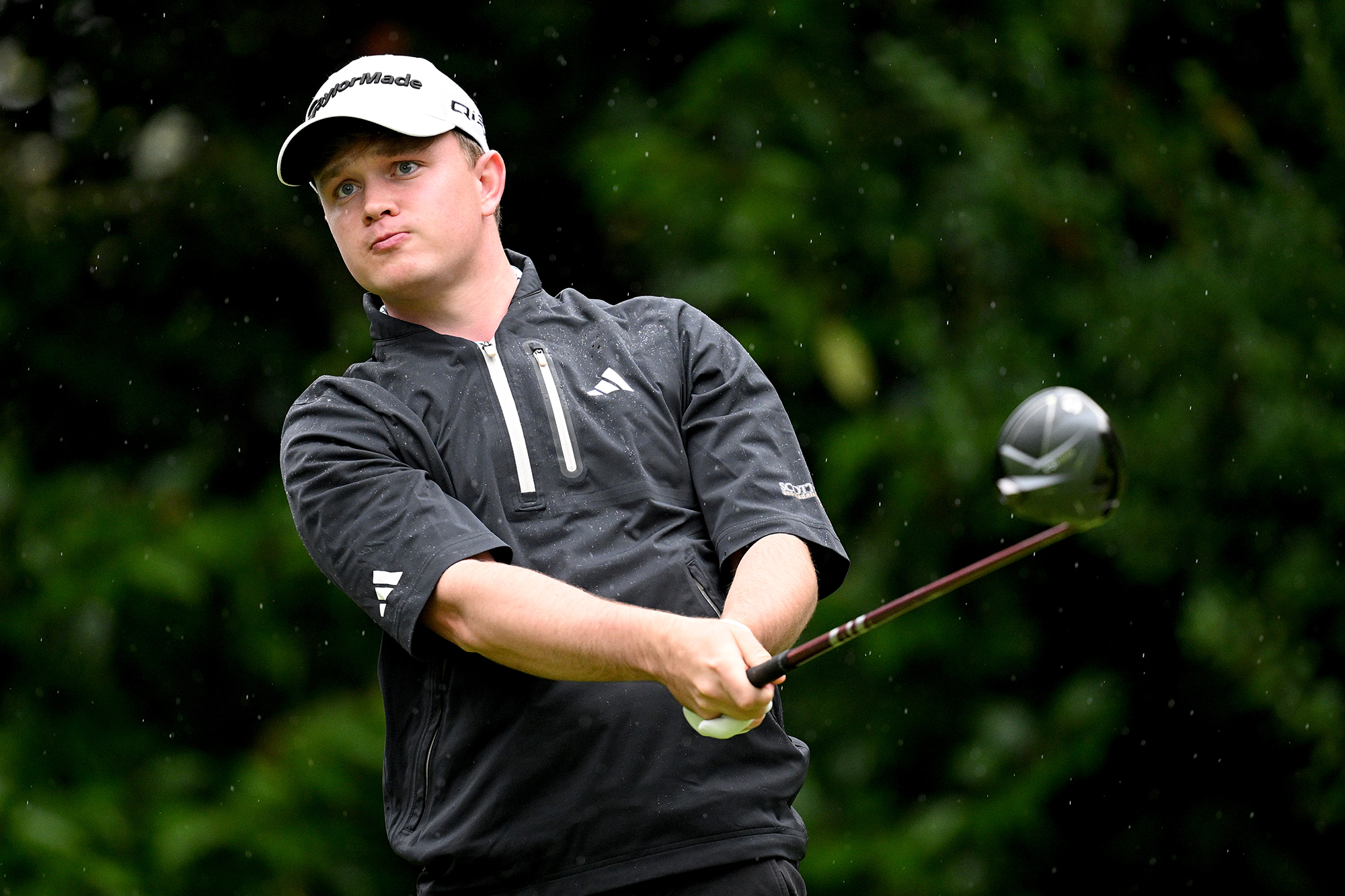 Jayden Schaper in the finish position with driver after taking a tee shot on the golf course