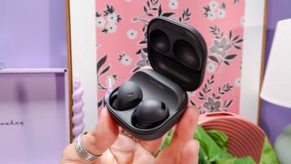 Galaxy Buds Pro 2 in black, in charge case held in hand