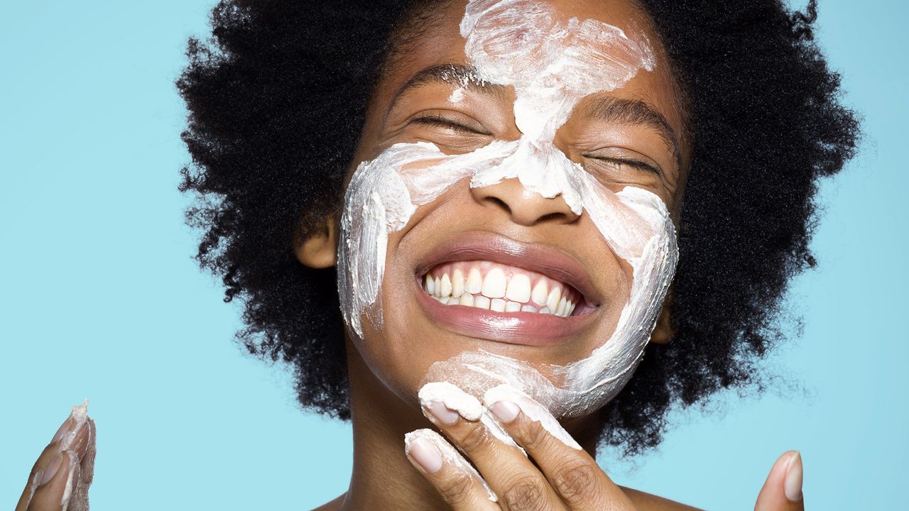 Woman cleaning her face