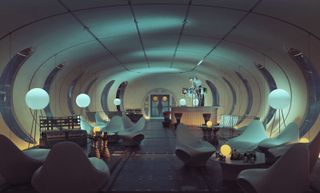 Lunar habitat interior with curved walls and spherical lamps