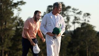 Ted Scott and Scottie Scheffler celebrate winning The Masters