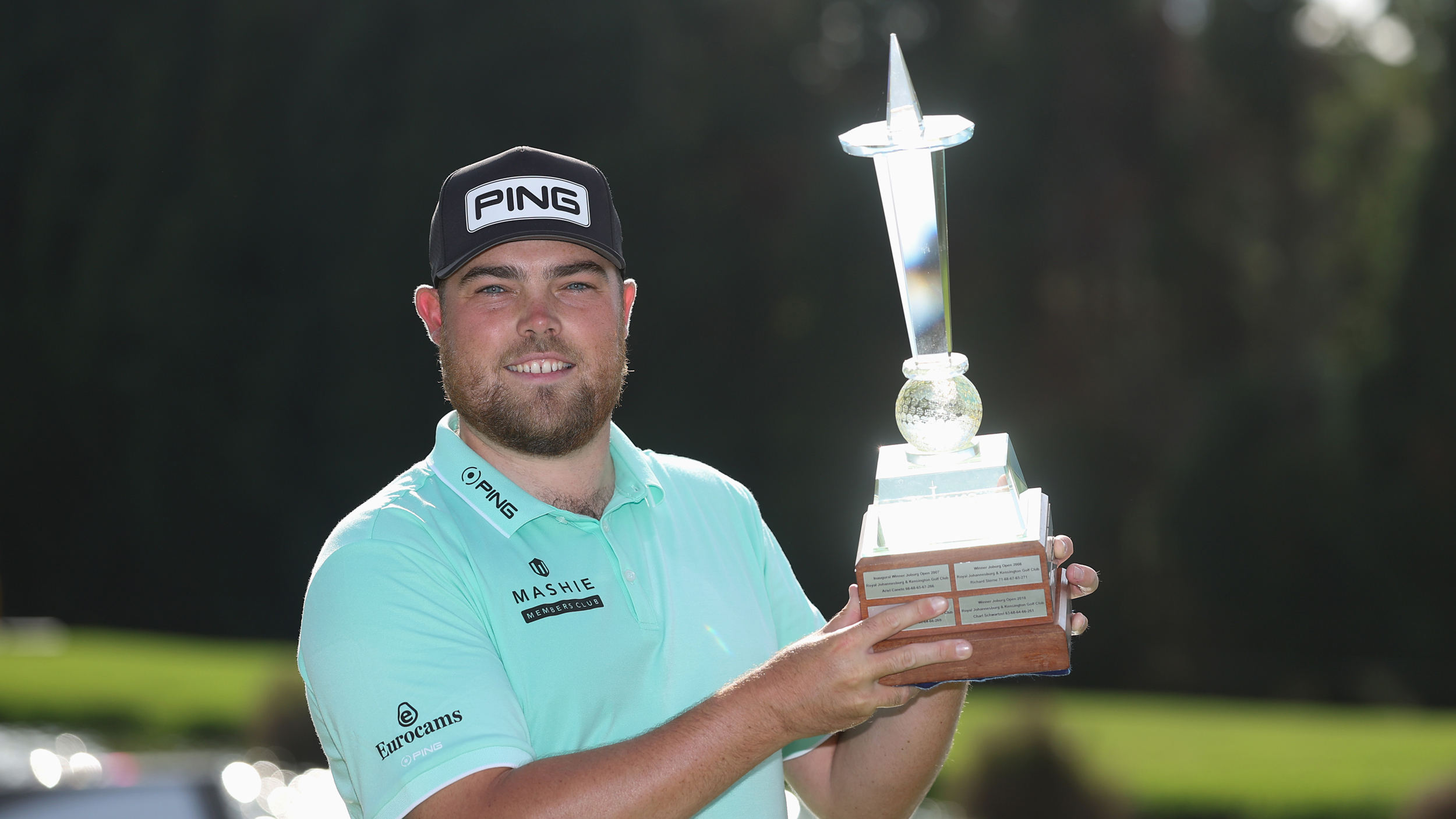 Dan Bradbury poses with the Joburg Open trophy after his win in 2026