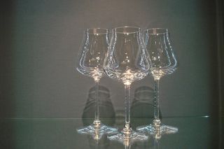 Three elegant glasses with long stems.