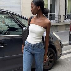 woman in tube top and jeans