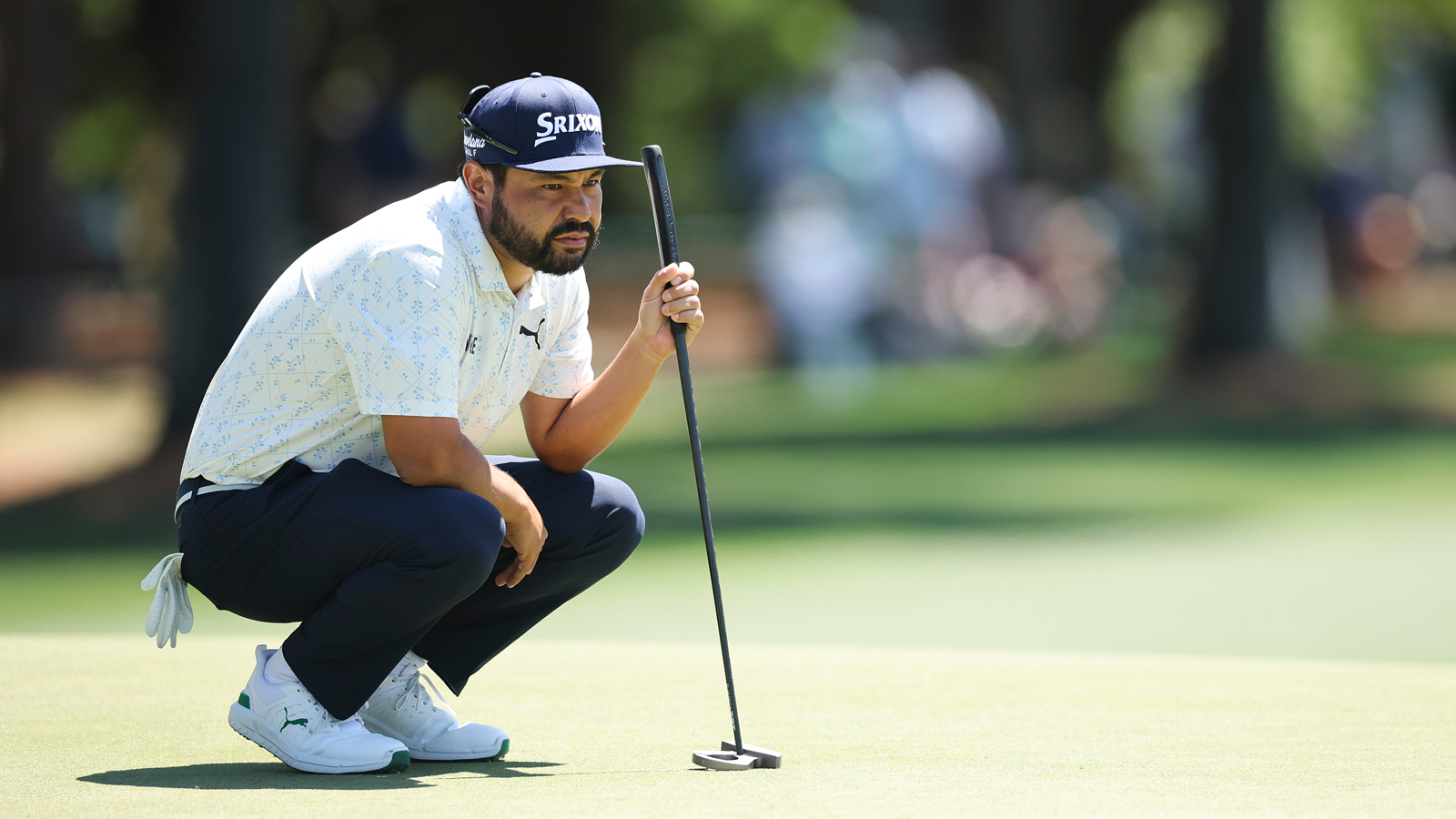 JJ Spaun lines up a putt