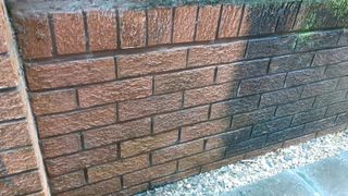 Wall cleaned with pressure washer