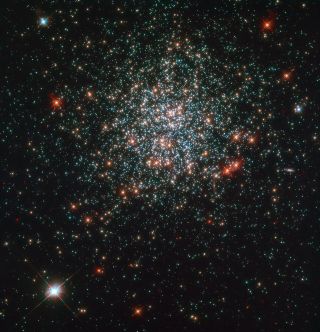 The star cluster NGC 2203 dazzles here in an image by the NASA/ESA Hubble Space Telescope. The cluster contains a number of interesting features including stars about twice as massive as our sun. In studying this cluster, astronomers hope to better understand the timeline and lives of stars.