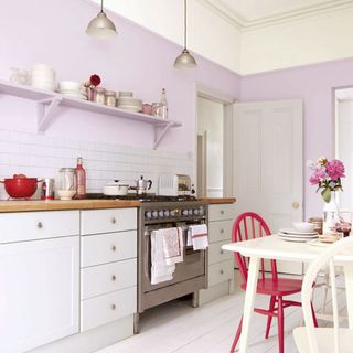 kitchen with purple wall and white cabinet