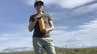 Julia Clarke hiking with the Hydro Flask 32oz bottle